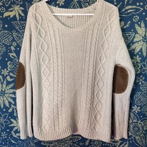 Cream cable knit sweater with elbow patches